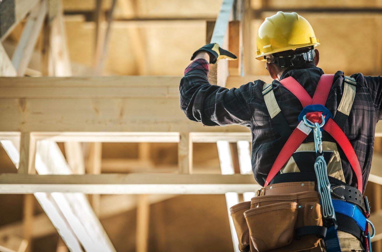 stock-photo-wood-construction-worker-caucasian-builder-wearing-safety-harness-and-the-wooden-house-structure-1544757758-transformed